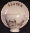 Ahgupuk cup and saucer featuring Alaskan Cache