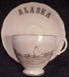 Ahgupuk cup and saucer featuring Eskimo in Oomiak