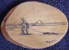 Ahgupuk art Eskimo dragging seal on Alaska woodcraft plaque