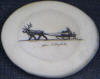 Weyahok oval scrimshaw reindeer pulling sled